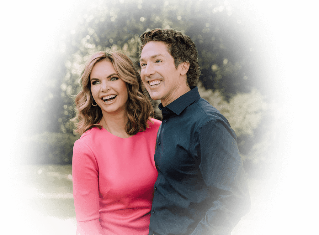 Joel and Victoria Osteen smiling in a garden.